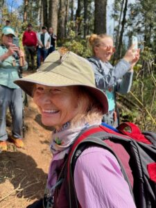 Vonceil Harmon of the Oklahoma Department of Transportation with monarch on her hat at the Monarch Butterfly Biosphere Reserve